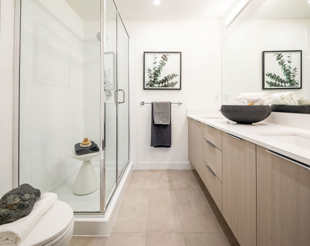 En suites with semi-floating vanities and plenty of counter space.